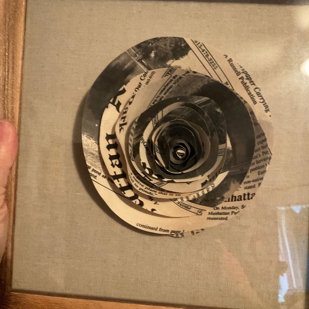 Framed flower made from newsprint. H131